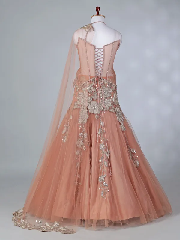 Peach net lehenga choli with attached dupatta