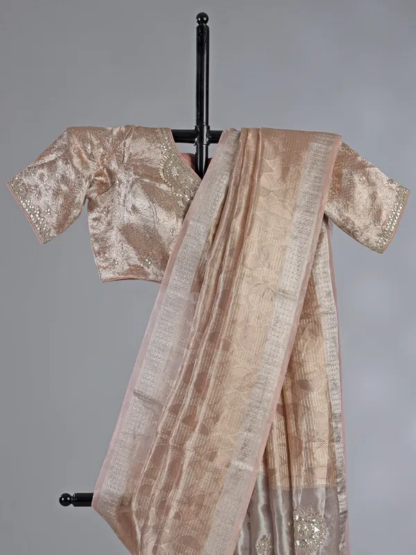 Peach organza saree with zari and sequins work
