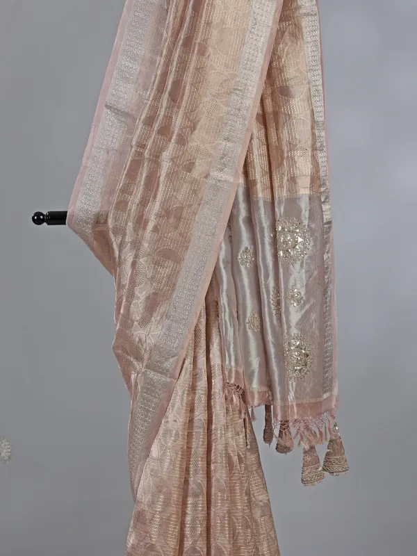 Peach organza saree with zari and sequins work