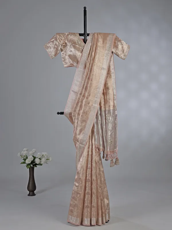 Peach organza saree with zari and sequins work
