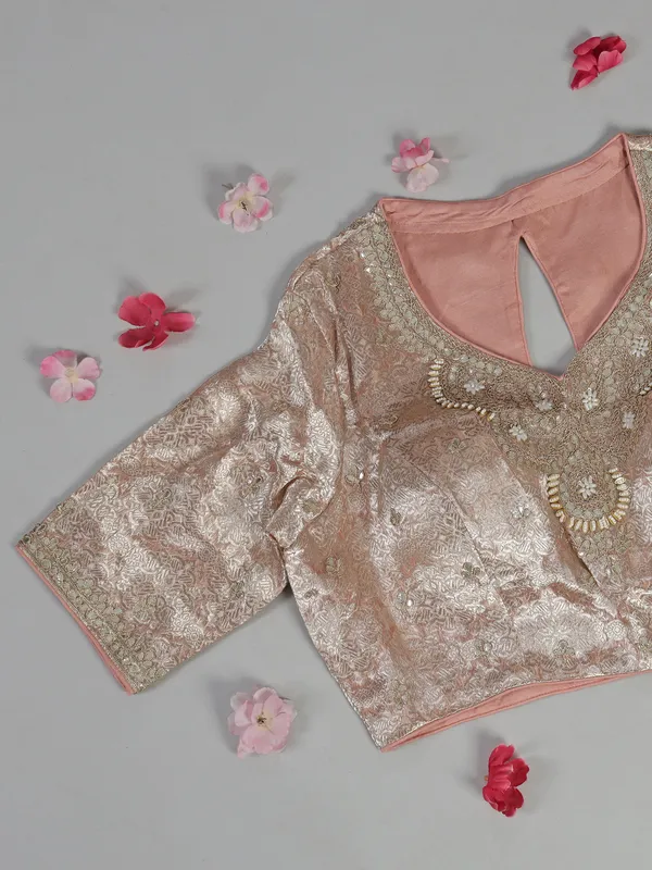 Peach organza saree with zari and sequins work