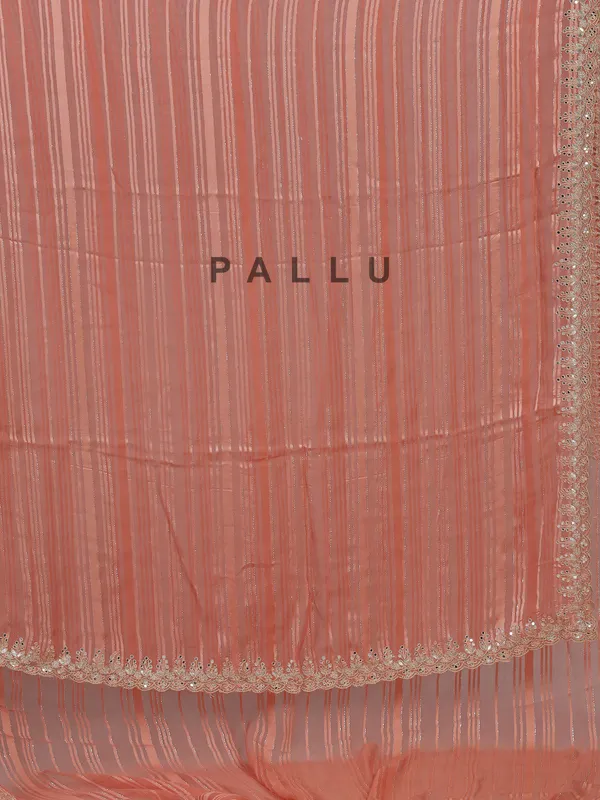 Peach organza satin silk saree with traditional embellishments