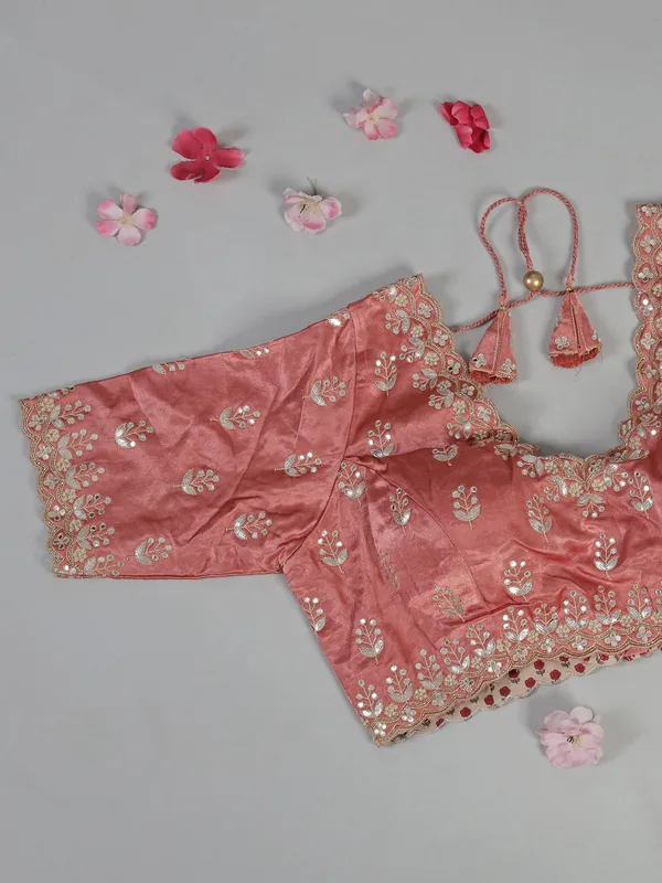 Peach organza satin silk saree with traditional embellishments