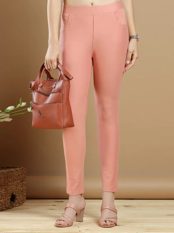 Peach plain jeggings for womens in lycra