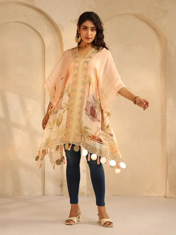Peach printed crepe silk ponchos top with sequins work