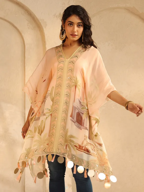 Peach printed crepe silk ponchos top with sequins work
