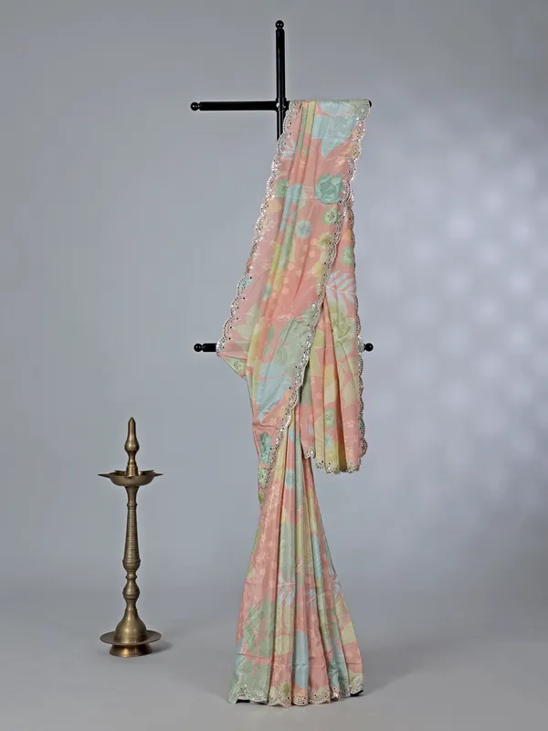 Peach printed crepe silk saree with mirror work