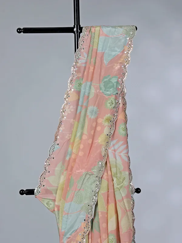 Peach printed crepe silk saree with mirror work