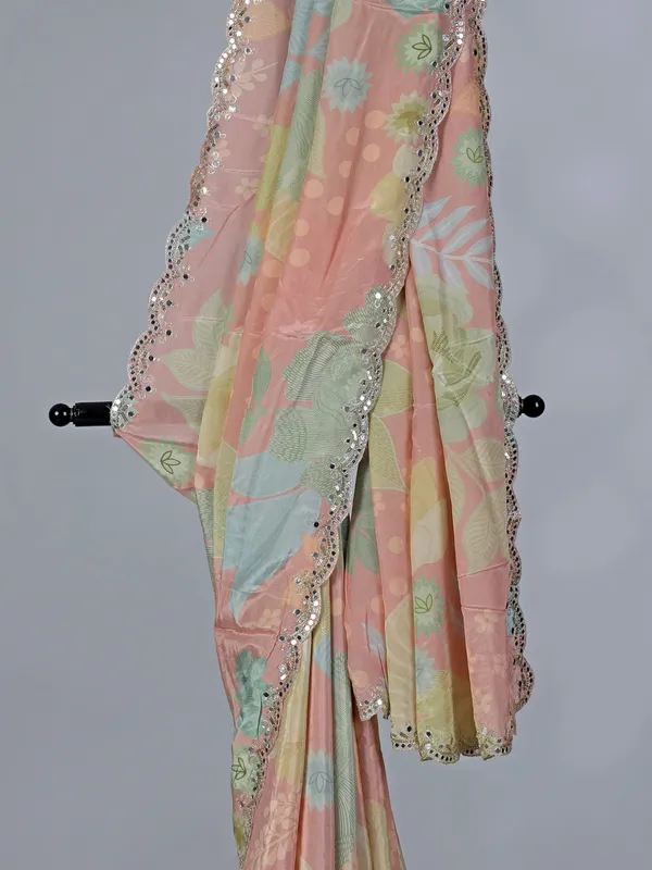 Peach printed crepe silk saree with mirror work