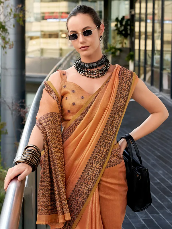 Peach printed linen tissue silk saree