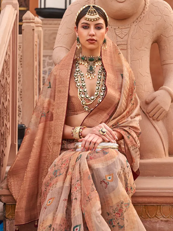 Peach printed organza saree with regal touch