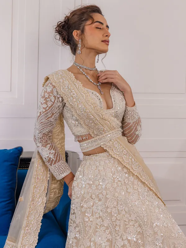Peach reception wear lehenga choli in soft net