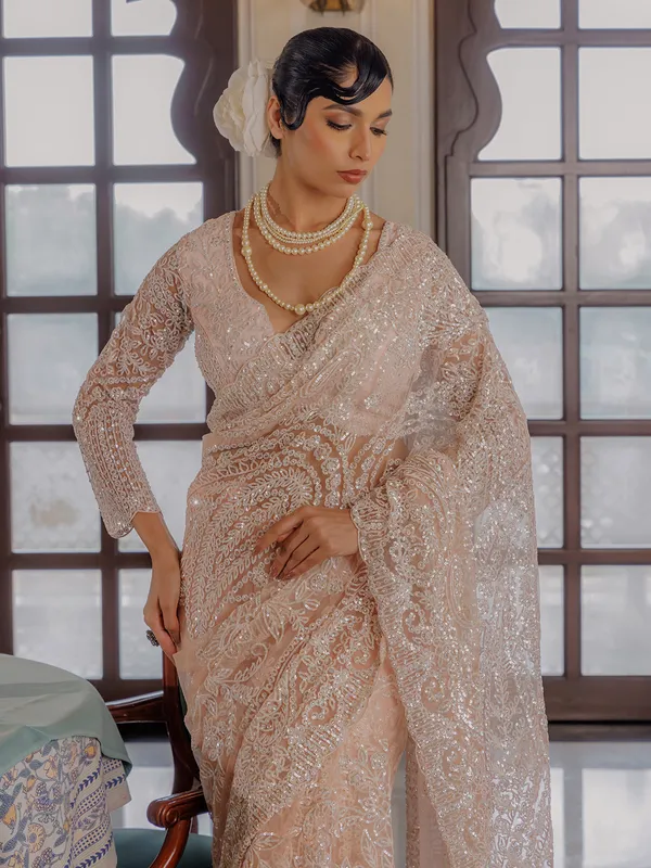 Peach sequins worked saree in soft net