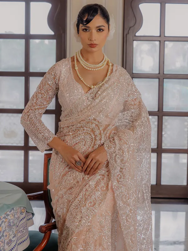 Peach sequins worked saree in soft net