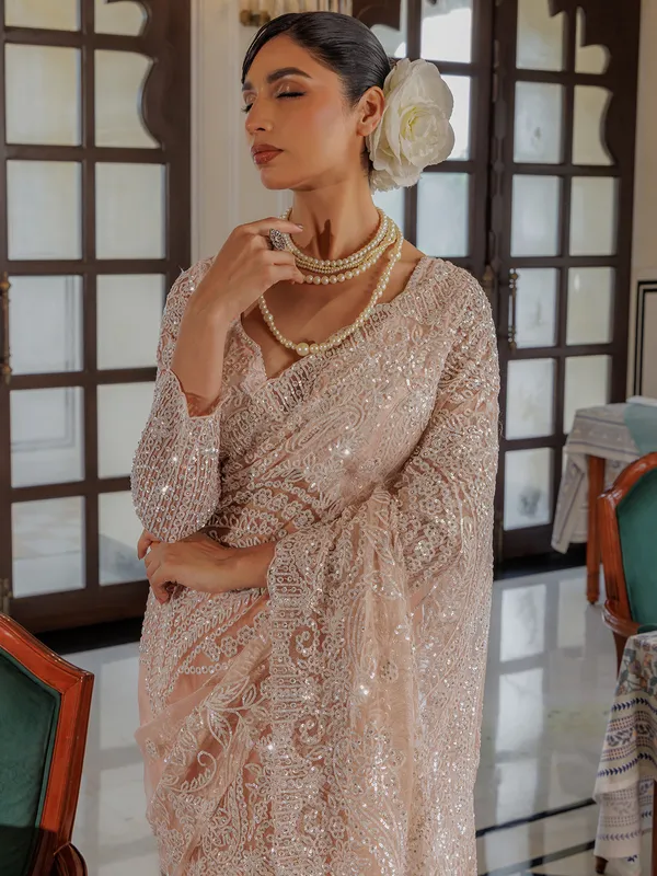 Peach sequins worked saree in soft net
