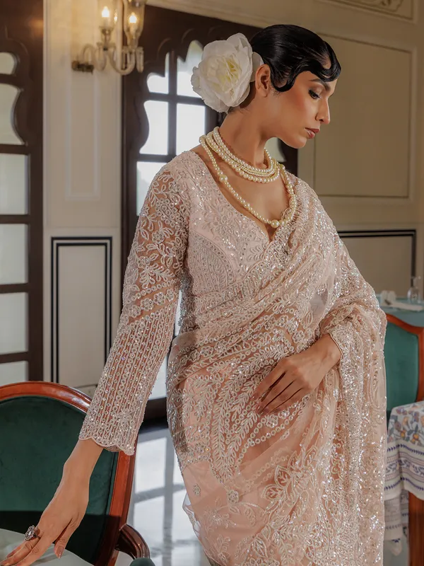 Peach sequins worked saree in soft net