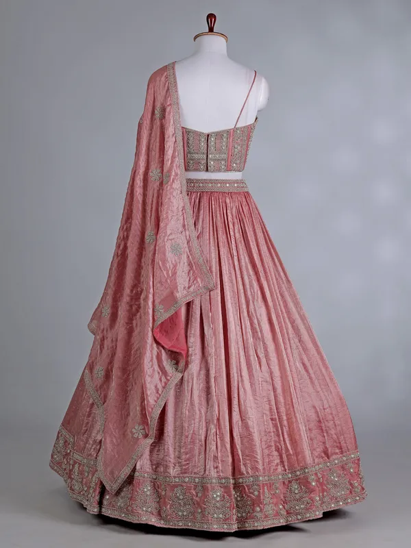 Peach silk bridal lehenga choli with sparkling stones