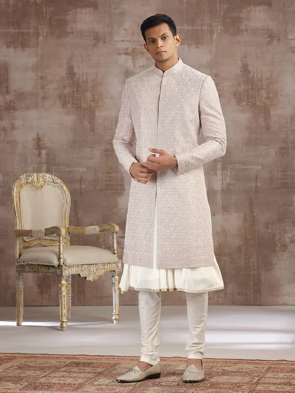 Peach silk peshwai sherwani with graceful accents