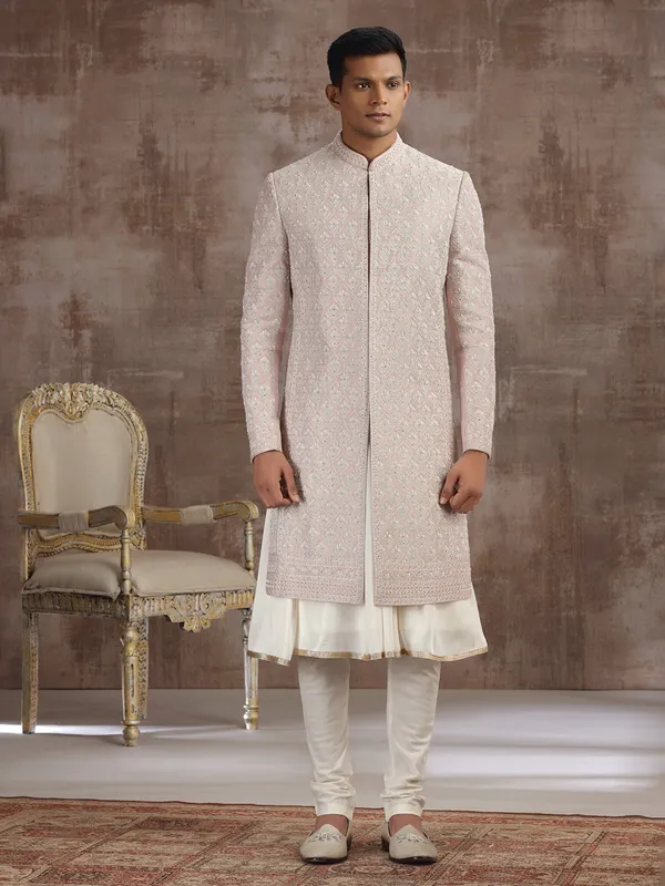 Peach silk peshwai sherwani with graceful accents