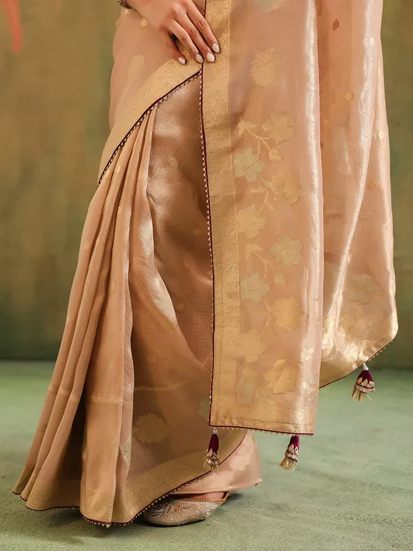 Peach silk saree with bold brown blouse wedding wear