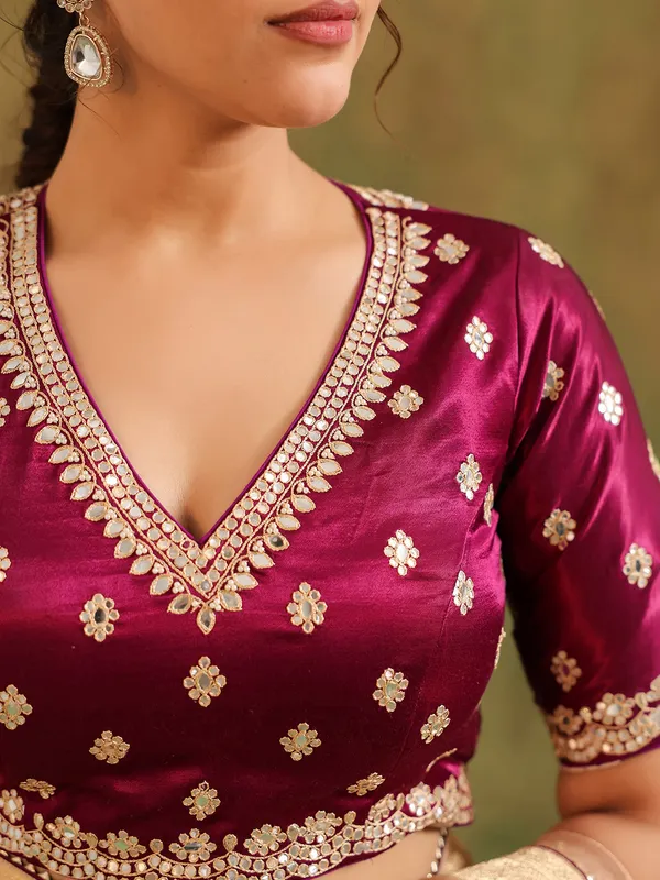 Peach silk saree with bold brown blouse wedding wear