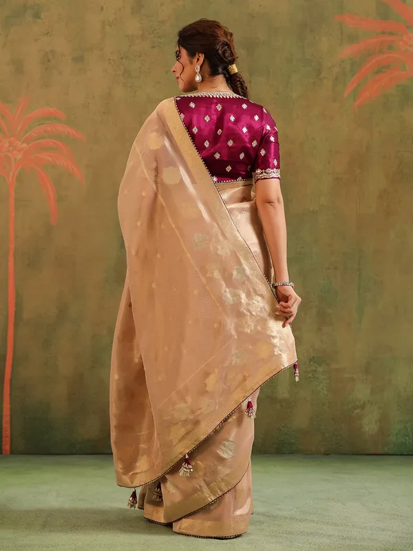 Peach silk saree with bold brown blouse wedding wear