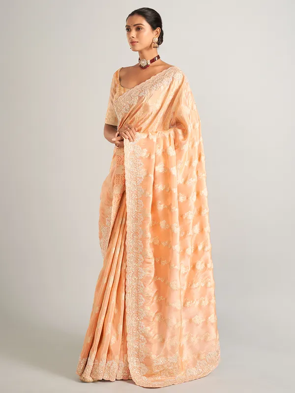 Peach silk zari worked saree with unstitched blouse