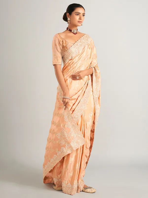 Peach silk zari worked saree with unstitched blouse