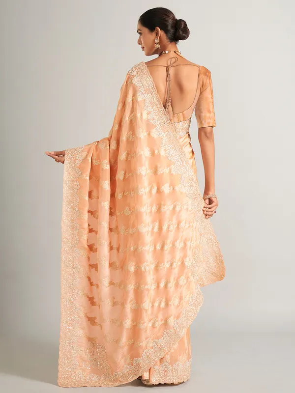 Peach silk zari worked saree with unstitched blouse