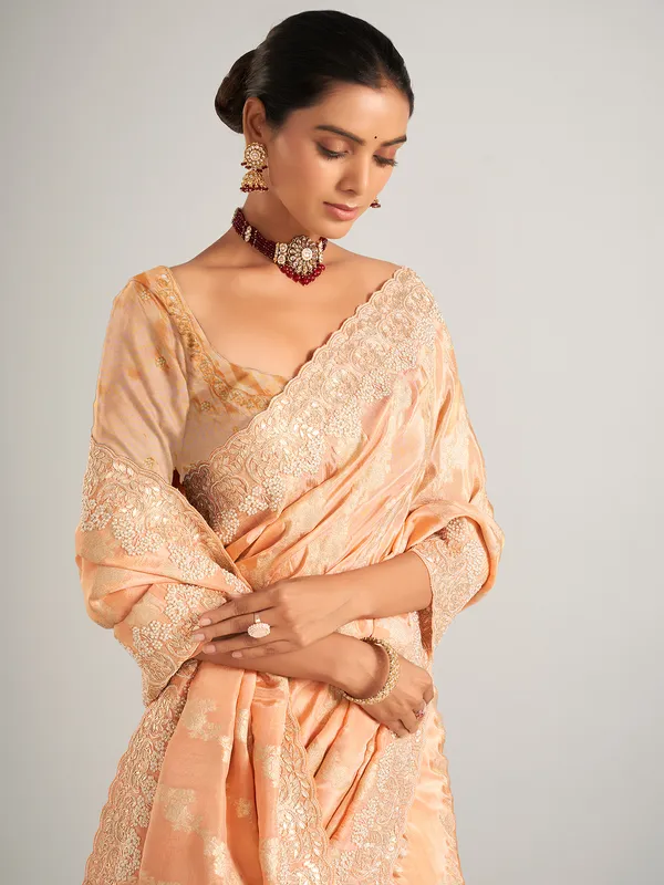 Peach silk zari worked saree with unstitched blouse