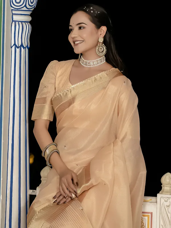 Peach tissue silk saree with elegant unstitched blouse