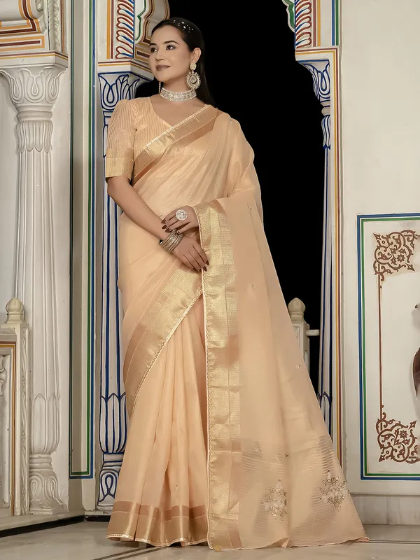 Peach tissue silk saree with elegant unstitched blouse