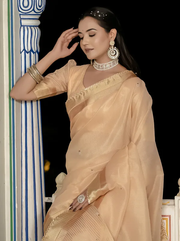 Peach tissue silk saree with elegant unstitched blouse