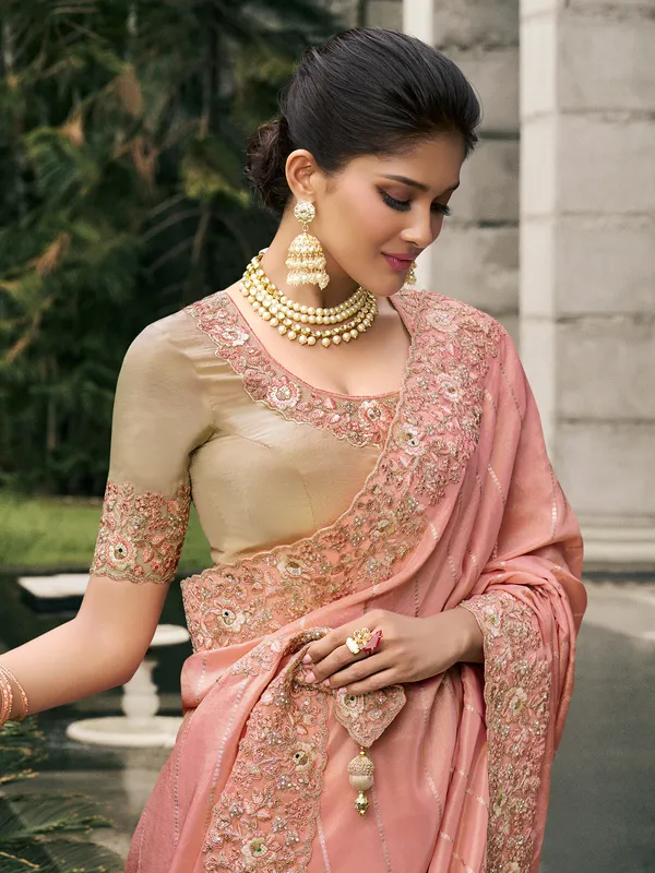 Peach tissue silk saree with zari and zardosi detailing