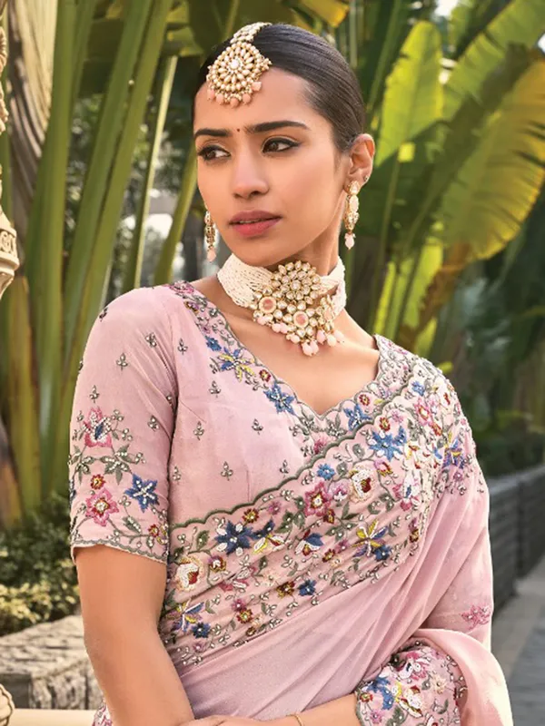 Pink banarasi saree with elegant moti accents