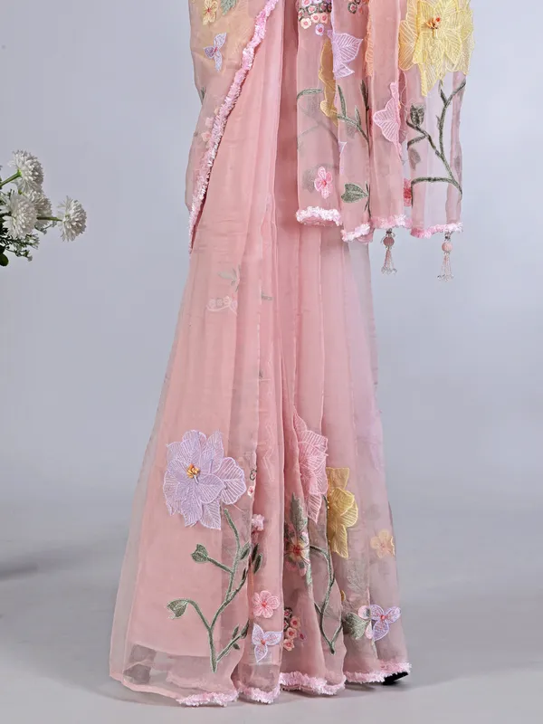 Pink embroidered organza saree for reception