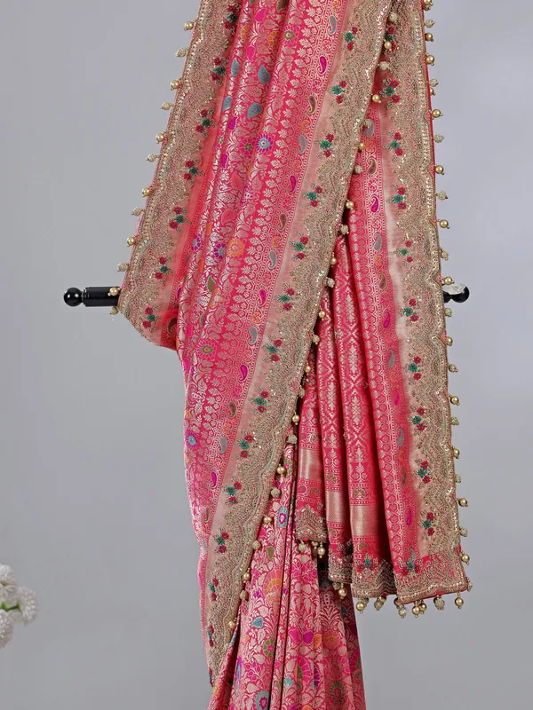 Pink kanjivaram silk saree with pearl and zardosi charm