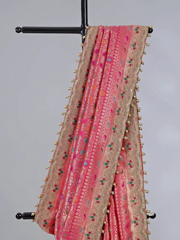 Pink kanjivaram silk saree with pearl and zardosi charm