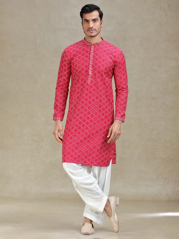 Pink kurta salwar in symmetrical embroidery pattern