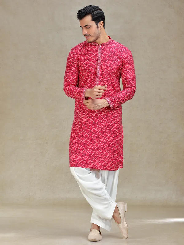 Pink kurta salwar in symmetrical embroidery pattern