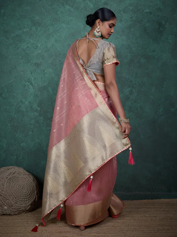 Pink linen blend saree with zari woven detailing