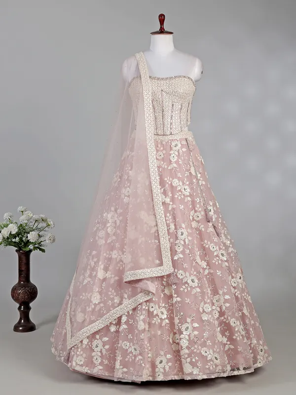 Pink net lehenga choli with sequins and thread work