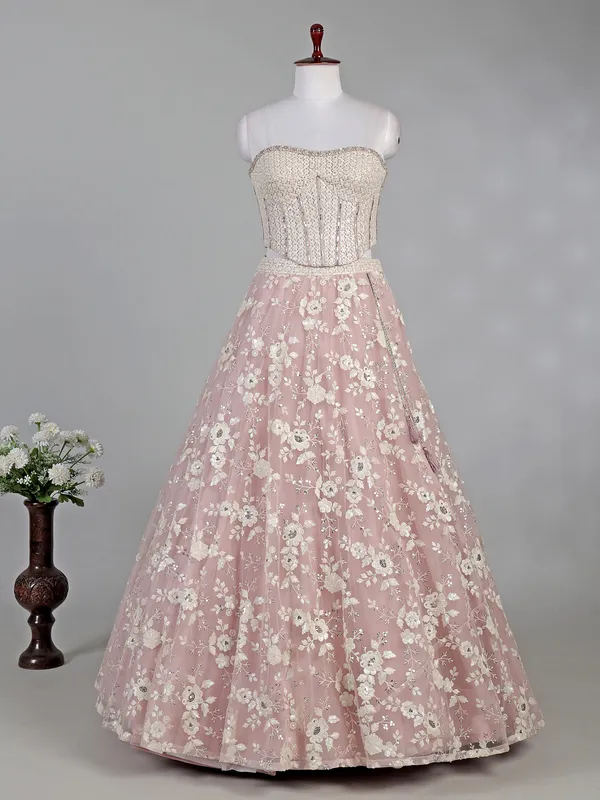 Pink net lehenga choli with sequins and thread work