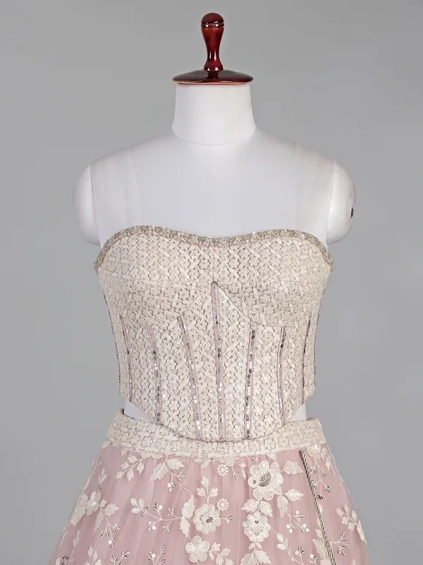 Pink net lehenga choli with sequins and thread work