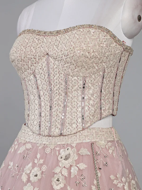 Pink net lehenga choli with sequins and thread work