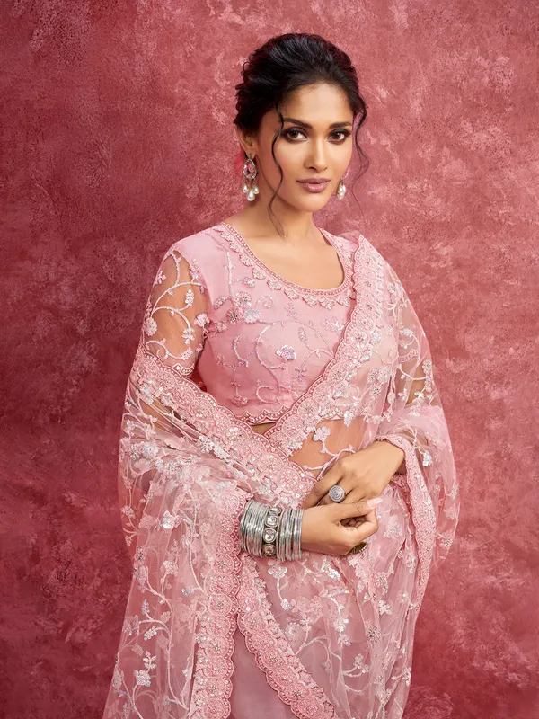 Pink net saree with sequins work for reception