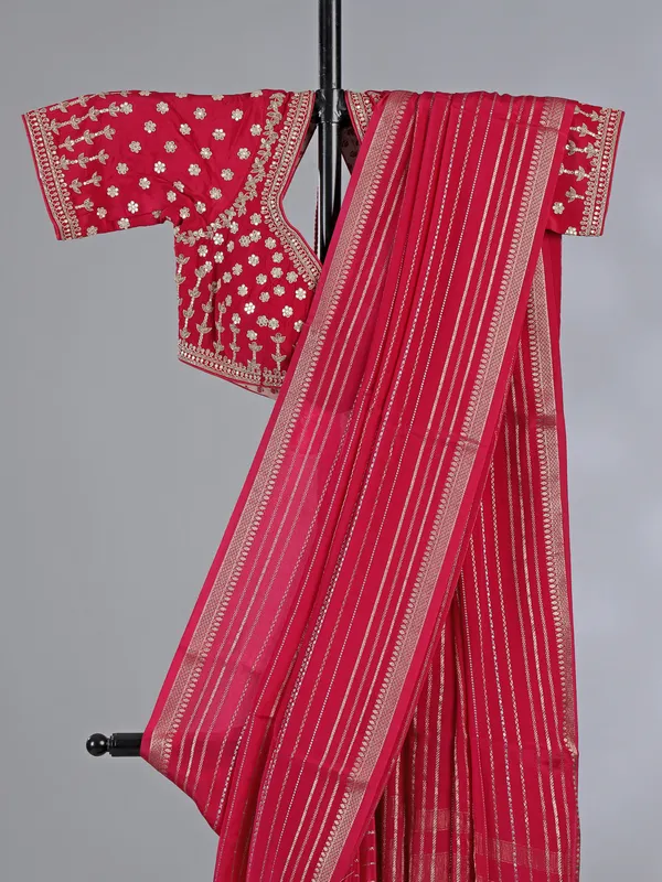 Pink organza saree with elegant zari weaving