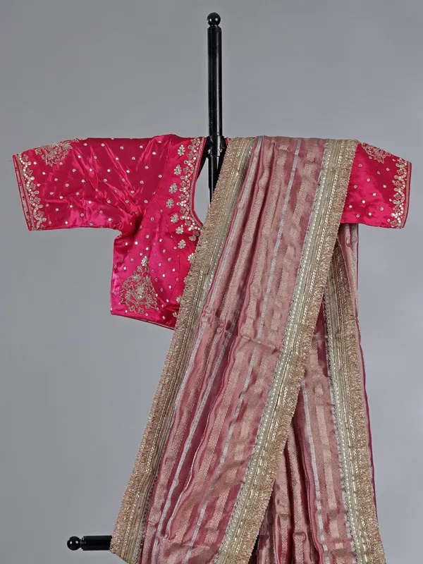Pink organza saree with mirror and aabla work