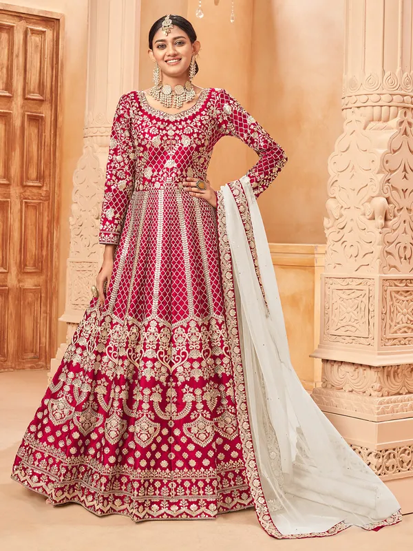 Pink round neck silk anarkali suit with zari detailing