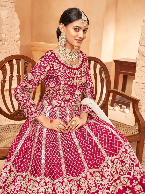 Pink round neck silk anarkali suit with zari detailing